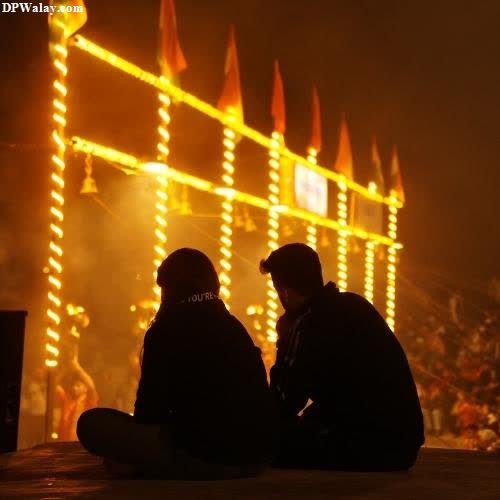 two people sitting on a bench in front of a stage romantic dp pic
