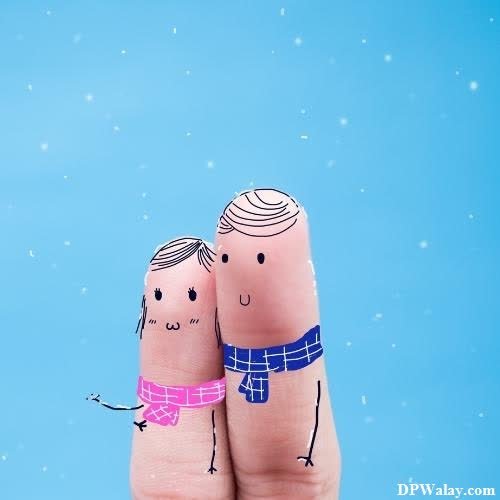 a couple holding hands in the snow-kzHs