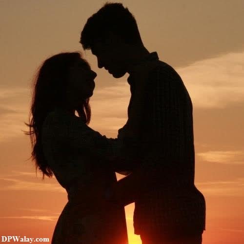 a couple kissing at sunset-Gfkm romantic love dp for whatsapp 