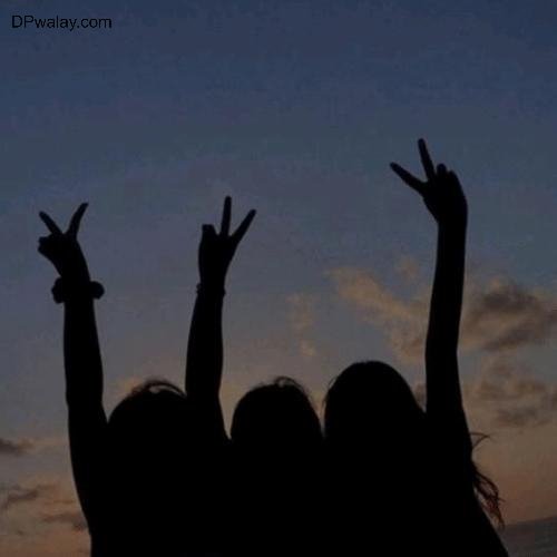 two girls are silhouetted against a sunset sky images by DPwalay