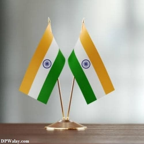 two miniature flags on a table tricolour dp for whatsapp