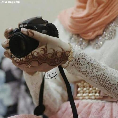Muslim Girl DP - a woman taking a photo with her camera