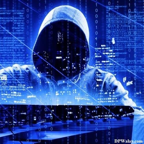 Hacker DP - a person in a hoodie with a laptop