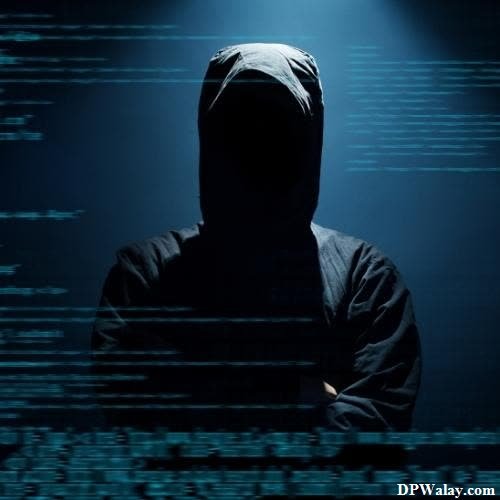 Hacker DP - a person in a hoodie standing in front of a dark background