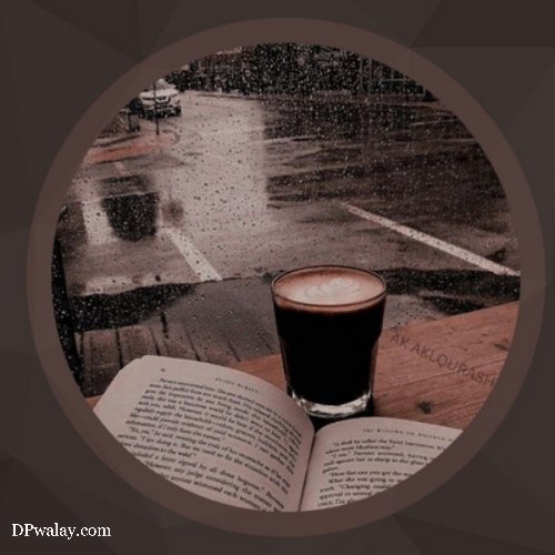 a cup of coffee and an open book on a rainy day