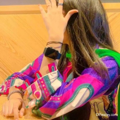 a girl is sitting at a table with her hand on her face cool photos for whatsapp dp girl