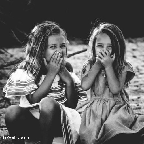 two little girls sitting on the beach with their hands in their mouths family dp for whatsapp