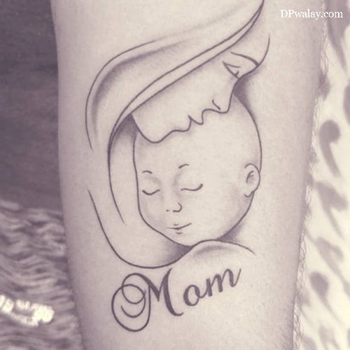 tattoo of mother's face with the word mom on it maa dp