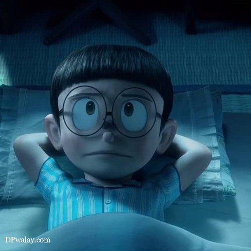 boy with glasses laying on bed