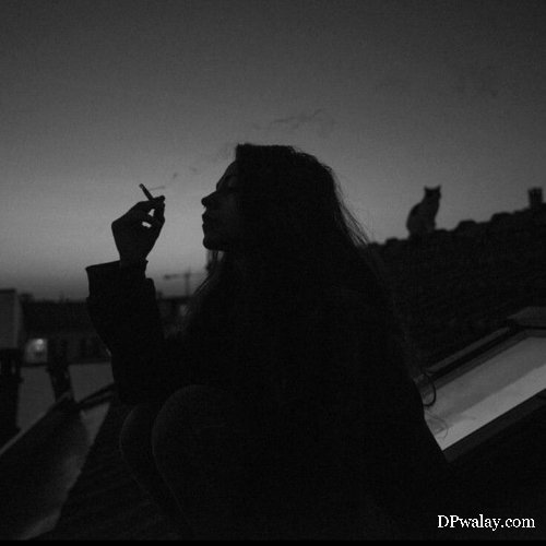 woman smoking on the roof of building sad smoking dp