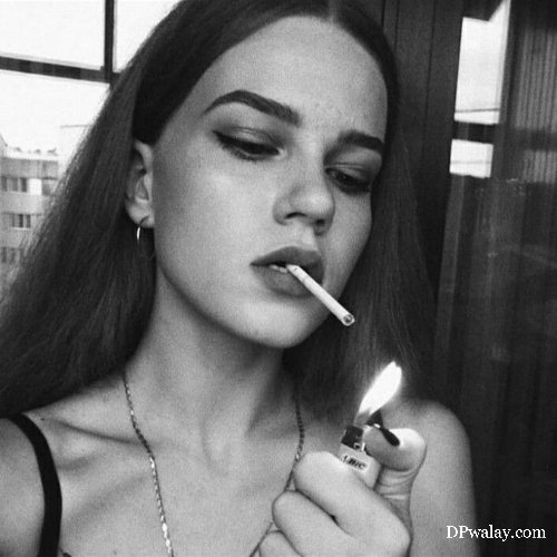 woman smoking cigarette in black and white photo
