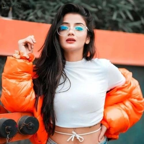 woman in an orange jacket and blue jeans stylish dp for girls