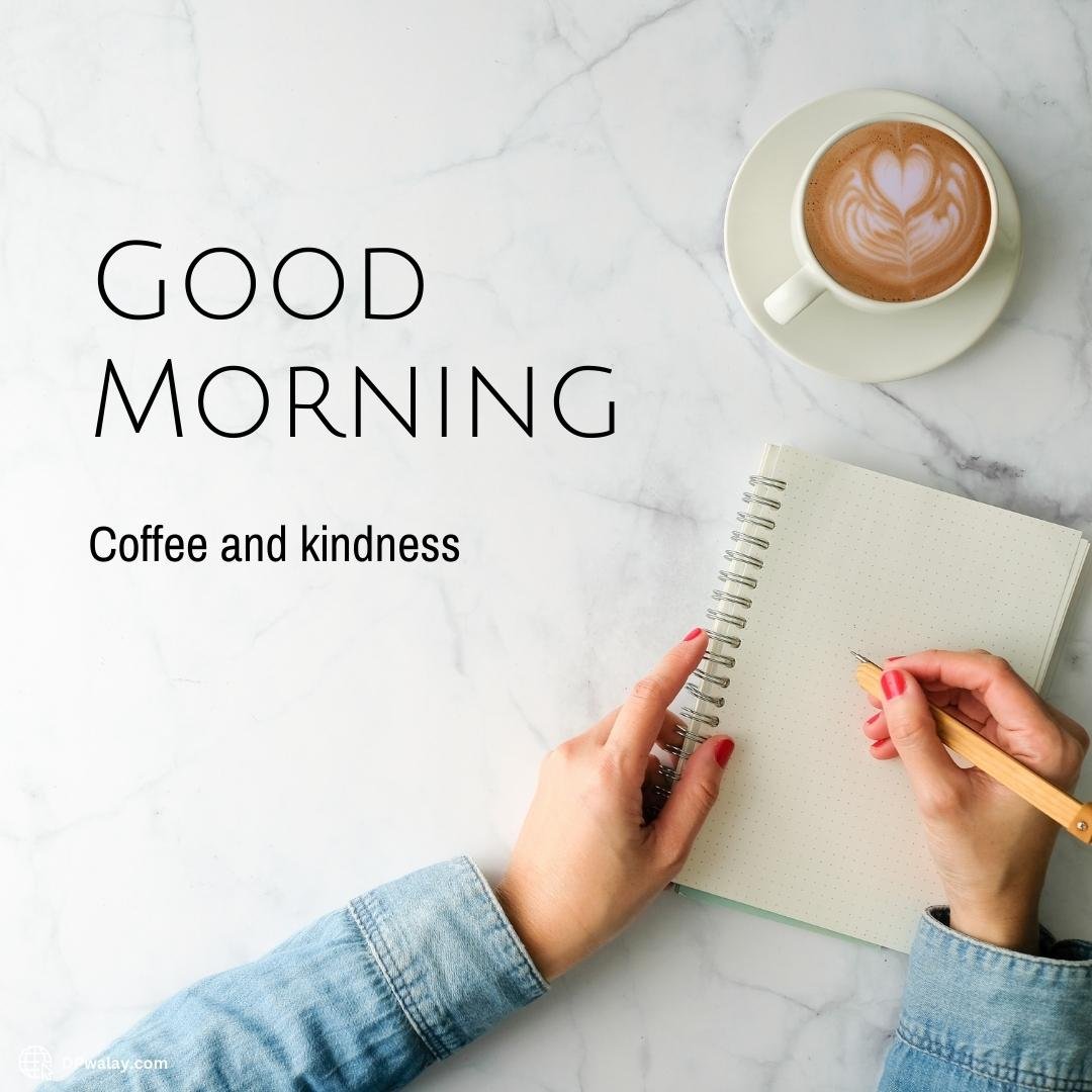 person writing on notebook with cup of coffee and cup of coffee