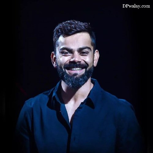 man with beard smiles at the camera virat kohli instagram dp